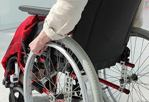 man-pushing-wheelchair