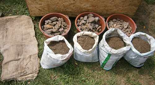 mini greenhouse earth and sand and rocks