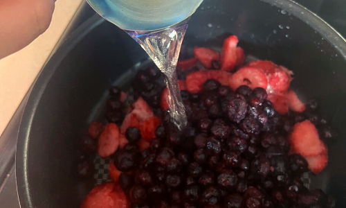 Adding water to a pan for making wojabi sauce