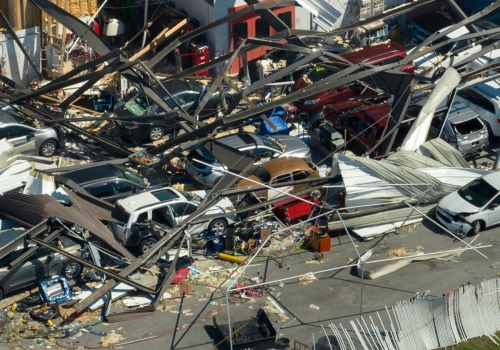 Picture with fallen buildings on cars