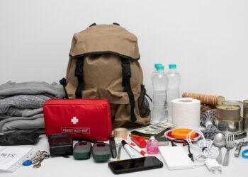 prepping items first aid kit and backpack